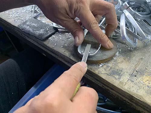 removing the sharp edges on the part
