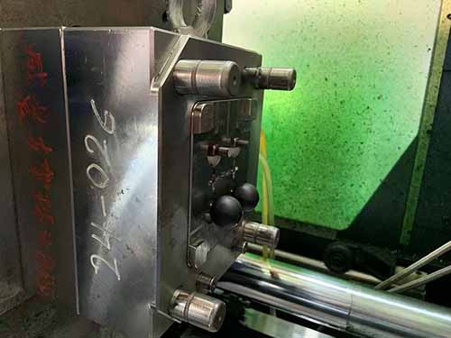 ejecting the wrapped metal ball